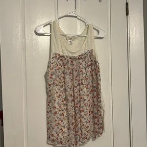 White sleeveless floral shirt